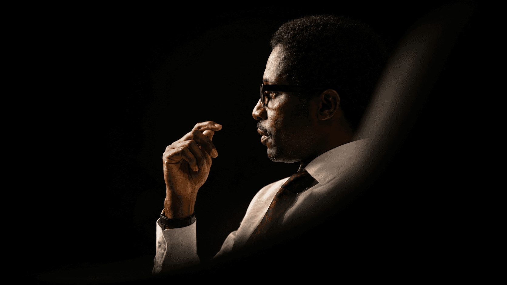 Dr. TEA in a focused profile portrait for the Certified Professional Coach Program